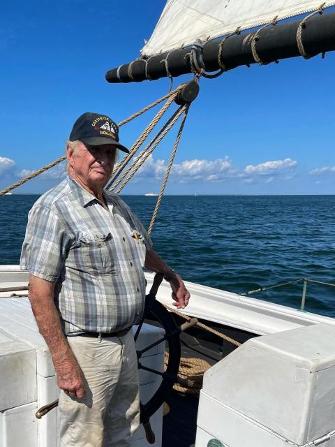 a man standing on a boat in the water